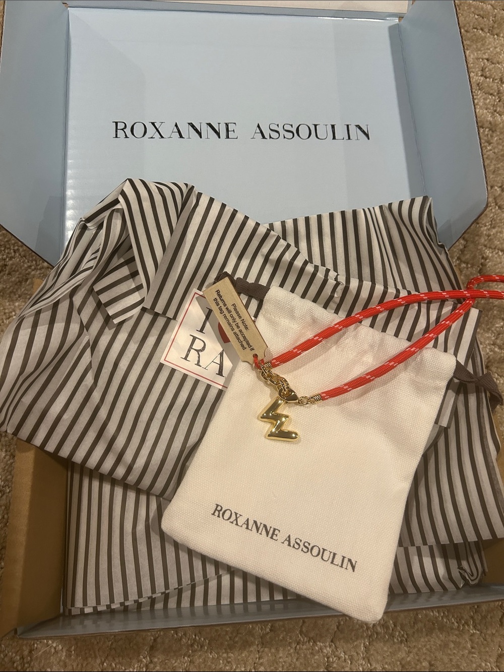 Roxanne Assoulin Red Rope Necklace with Gold Lightning Charm Pendant